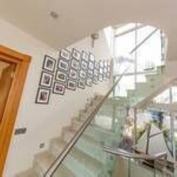 Statement staircase with glass balustrade